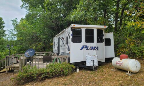 8 Acres Wooded Land with 28’ Camper near De Soto, WI!