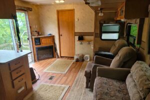 8 Acres Wooded Land with 28’ Camper near De Soto, WI!