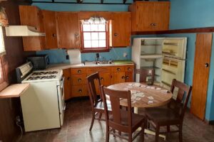 4.2-acre wooded property with 2-bedroom cabin near Fishtrap Lake in Sawyer County, WI, offering privacy, lake access, and Northwoods recreation