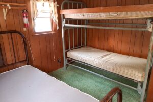 4.2-acre wooded property with 2-bedroom cabin near Fishtrap Lake in Sawyer County, WI, offering privacy, lake access, and Northwoods recreation