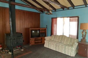 4.2-acre wooded property with 2-bedroom cabin near Fishtrap Lake in Sawyer County, WI, offering privacy, lake access, and Northwoods recreation