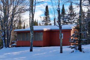 4.2-acre wooded property with 2-bedroom cabin near Fishtrap Lake in Sawyer County, WI, offering privacy, lake access, and Northwoods recreation