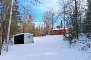 4.2-acre wooded property with 2-bedroom cabin near Fishtrap Lake in Sawyer County, WI, offering privacy, lake access, and Northwoods recreation