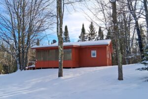 4.2-acre wooded property with 2-bedroom cabin near Fishtrap Lake in Sawyer County, WI, offering privacy, lake access, and Northwoods recreation