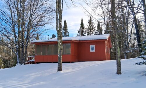 4.2-acre wooded property with 2-bedroom cabin near Fishtrap Lake in Sawyer County, WI, offering privacy, lake access, and Northwoods recreation
