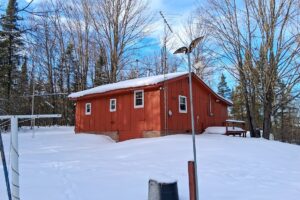 4.2-acre wooded property with 2-bedroom cabin near Fishtrap Lake in Sawyer County, WI, offering privacy, lake access, and Northwoods recreation