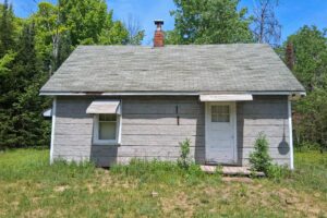 Somo River waterfront property near Tomahawk & Tripoli, WI. Includes cabin, well, septic, and electric. Nearly 400 ft frontage