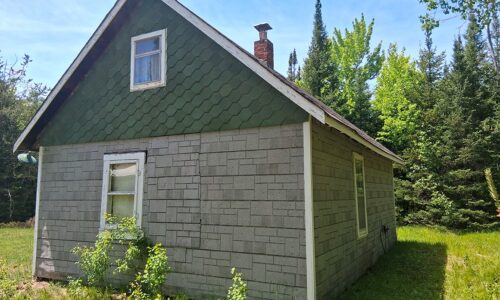 Somo River waterfront property near Tomahawk & Tripoli, WI. Includes cabin, well, septic, and electric. Nearly 400 ft frontage